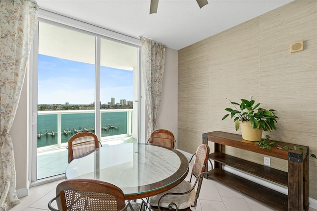 241 Riverside Dr Unit 902, Holly Hill, FL 32117 - dining room with a ceiling fan, a wealth of natural light, and light tile patterned flooring
