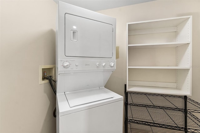 241 Riverside Dr Unit 902, Holly Hill, FL 32117 - laundry area featuring stacked washer and clothes dryer and laundry area