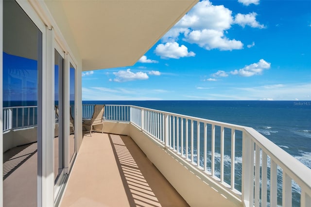 balcony featuring a water view