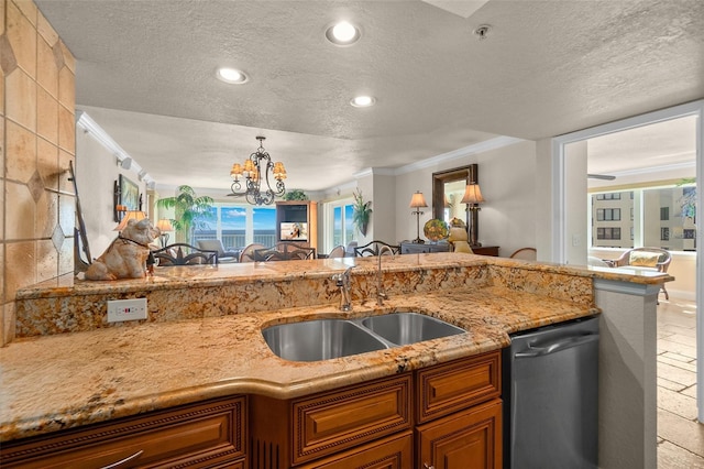 kitchen with open floor plan, stainless steel dishwasher, a textured ceiling, and a sink