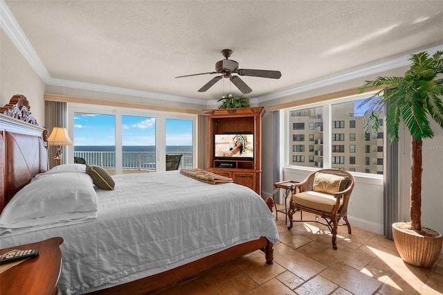 bedroom with stone tile floors, ornamental molding, access to outside, and ceiling fan