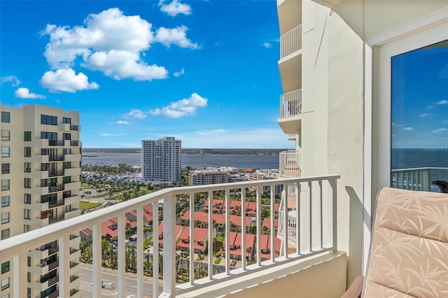 balcony featuring a water view