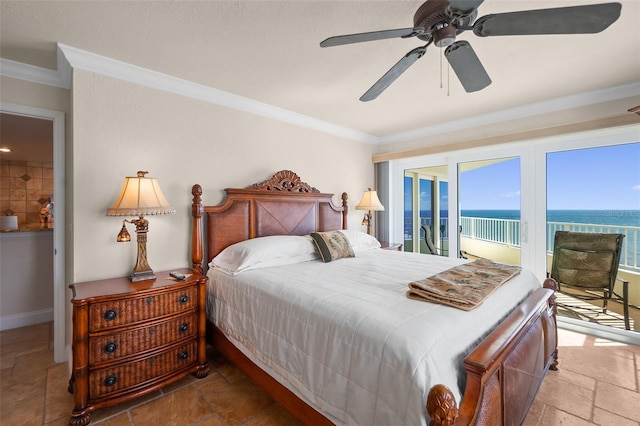 bedroom with stone tile floors, ornamental molding, access to exterior, and multiple windows