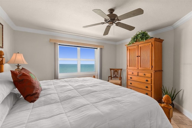 bedroom featuring crown molding, a ceiling fan, and baseboards