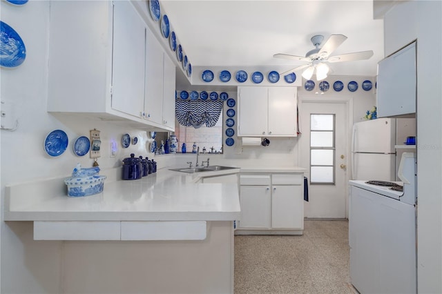 1148 Briarwood Ave, Deltona, FL 32725 - kitchen featuring a ceiling fan, a sink, white appliances, light countertops, and white cabinets