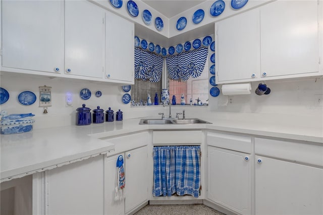 1148 Briarwood Ave, Deltona, FL 32725 - kitchen with white cabinets, light countertops, light speckled floor, and a sink
