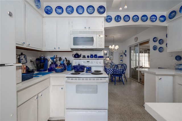 1148 Briarwood Ave, Deltona, FL 32725 - kitchen featuring light countertops, white appliances, and white cabinetry