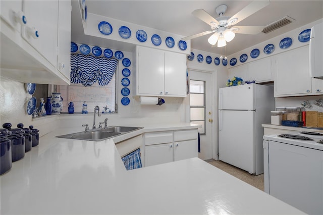 1148 Briarwood Ave, Deltona, FL 32725 - kitchen with visible vents, a ceiling fan, a sink, white appliances, and white cabinetry