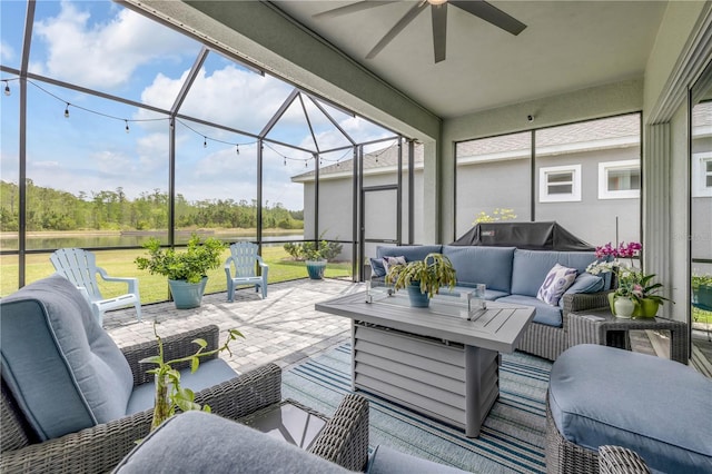 660 Mosaic Blvd, Daytona Beach, FL 32124 - view of patio featuring an outdoor living space, a ceiling fan, glass enclosure, and a water view