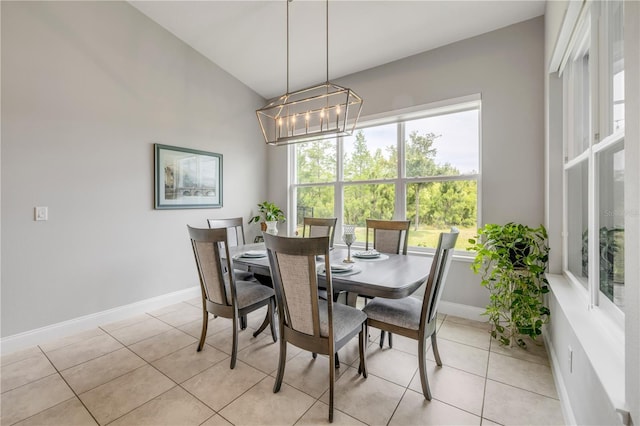 660 Mosaic Blvd, Daytona Beach, FL 32124 - dining area with light tile patterned floors, baseboards, and a chandelier