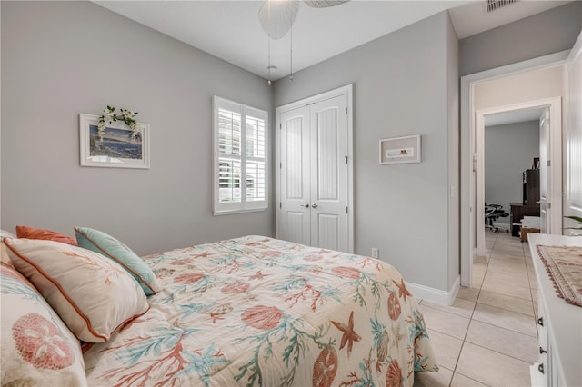 660 Mosaic Blvd, Daytona Beach, FL 32124 - bedroom featuring a closet, light tile patterned floors, and baseboards