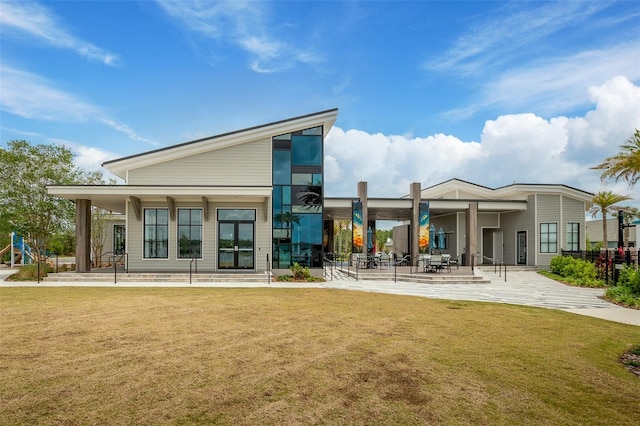 660 Mosaic Blvd, Daytona Beach, FL 32124 - rear view of house with a yard