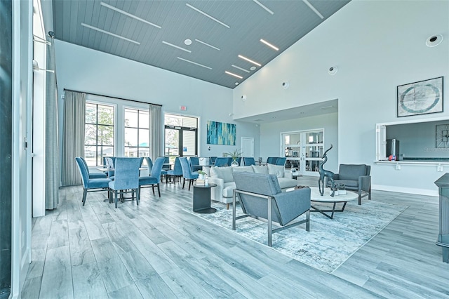 660 Mosaic Blvd, Daytona Beach, FL 32124 - living area with high vaulted ceiling, wood finished floors, and baseboards