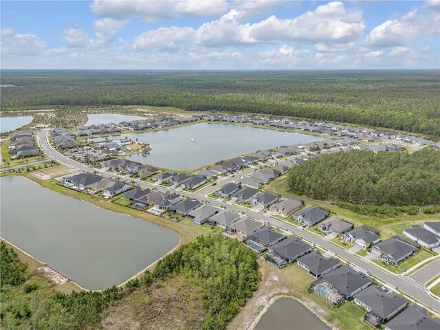 660 Mosaic Blvd, Daytona Beach, FL 32124 - view of property location featuring a heavily wooded area, a nearby body of water, and nearby suburban area