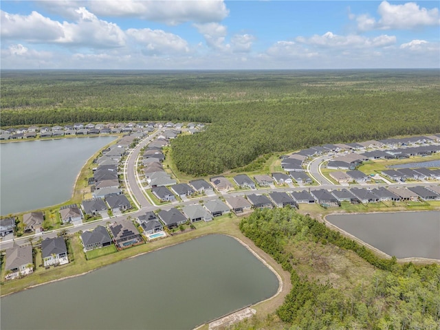 660 Mosaic Blvd, Daytona Beach, FL 32124 - aerial view of property and surrounding area featuring a heavily wooded area, nearby suburban area, and a large body of water