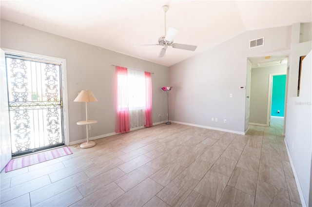unfurnished room featuring a ceiling fan, visible vents, vaulted ceiling, and baseboards