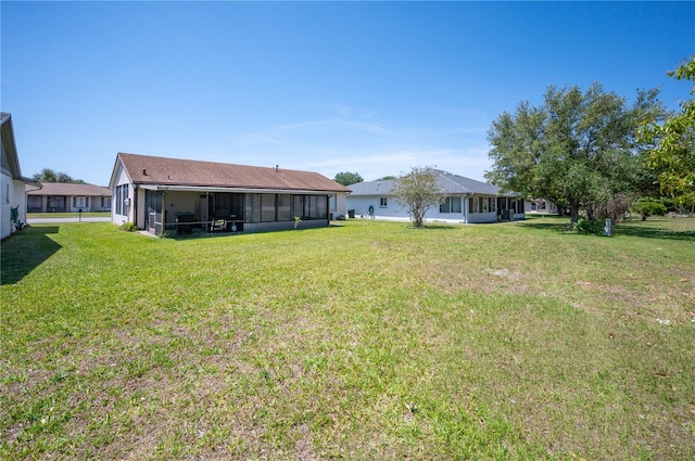 view of yard featuring a sunroom
