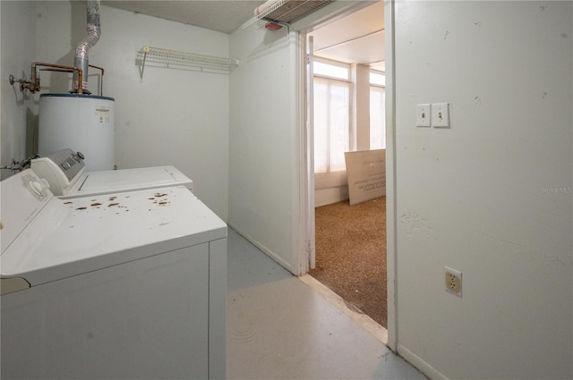laundry area featuring gas water heater, independent washer and dryer, and laundry area