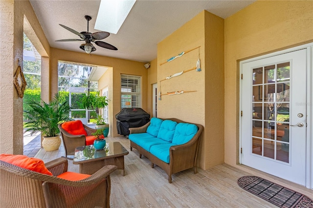 sunroom featuring a skylight