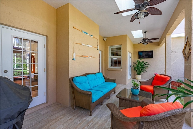 sunroom featuring a skylight