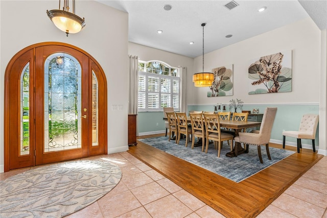 entryway featuring baseboards, visible vents, recessed lighting, and light tile patterned floors