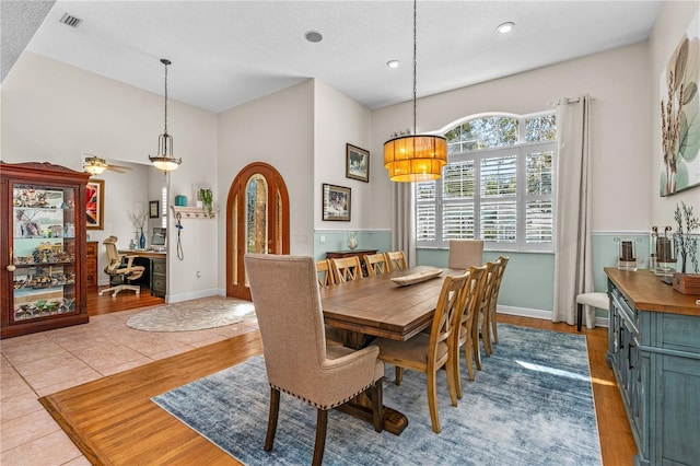 dining area with a textured ceiling, visible vents, baseboards, recessed lighting, and wood finished floors