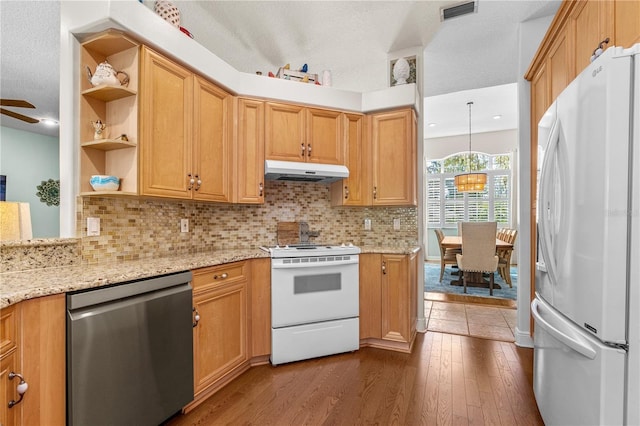 kitchen with open shelves, under cabinet range hood, white appliances, dark wood-style flooring, and visible vents
