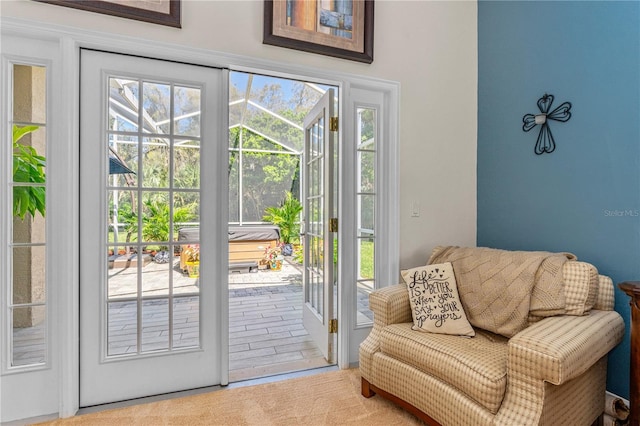 entryway featuring a sunroom and plenty of natural light