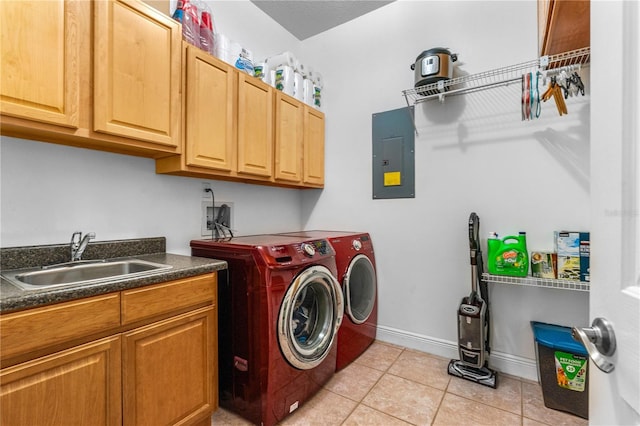 laundry room featuring electric panel, a sink, separate washer and dryer, cabinet space, and light tile patterned floors