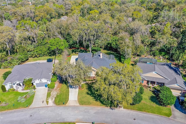 aerial view featuring a wooded view