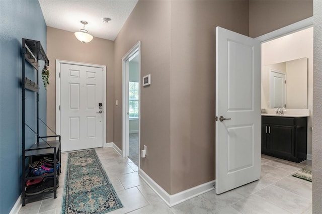 1079 Quaker Ridge Ln, Davenport, FL 33896 - entrance foyer with light tile patterned floors and baseboards