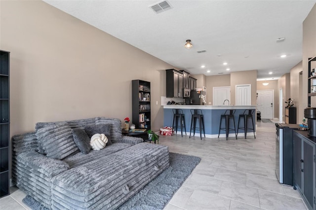 1079 Quaker Ridge Ln, Davenport, FL 33896 - living room featuring visible vents and recessed lighting