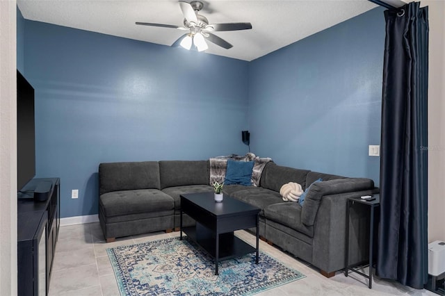 1079 Quaker Ridge Ln, Davenport, FL 33896 - tiled living room featuring ceiling fan and baseboards