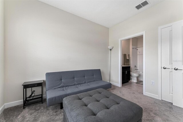 1079 Quaker Ridge Ln, Davenport, FL 33896 - living area with visible vents, carpet, and baseboards