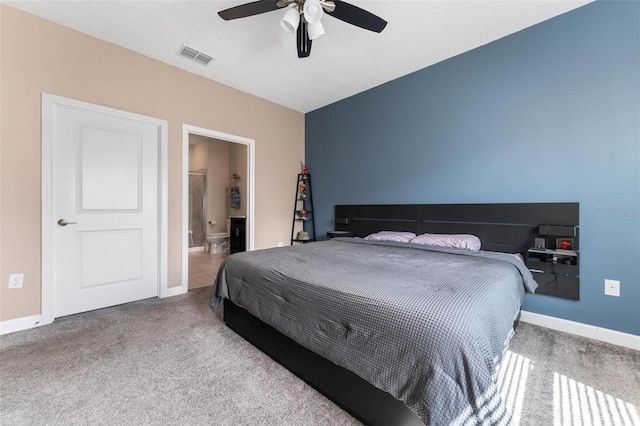 1079 Quaker Ridge Ln, Davenport, FL 33896 - carpeted bedroom featuring visible vents, ceiling fan, connected bathroom, and baseboards