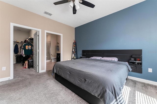 1079 Quaker Ridge Ln, Davenport, FL 33896 - carpeted bedroom featuring a closet, a ceiling fan, a walk in closet, visible vents, and baseboards