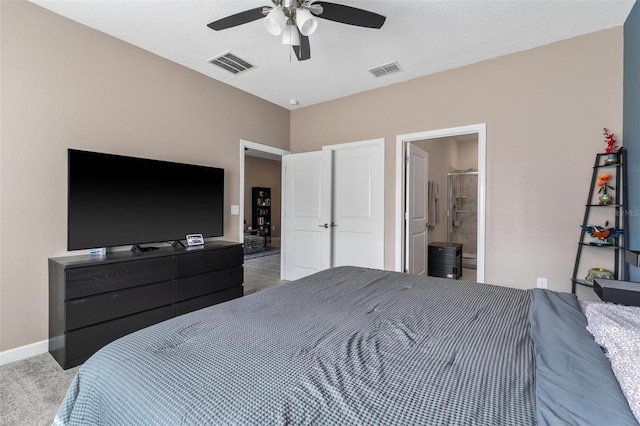 1079 Quaker Ridge Ln, Davenport, FL 33896 - bedroom featuring baseboards, visible vents, ceiling fan, and ensuite bath