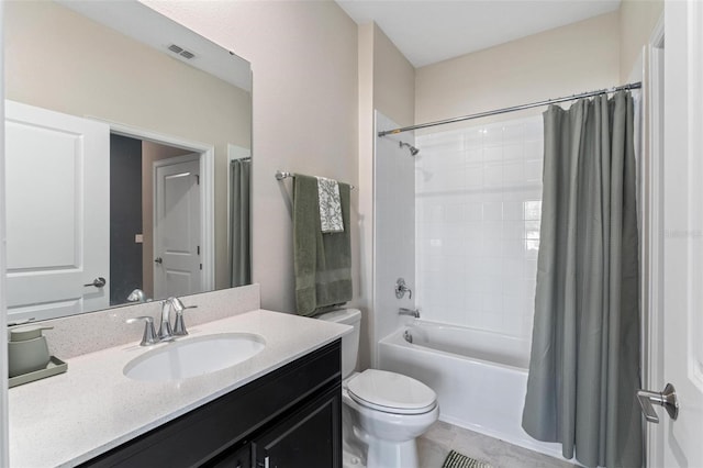 1079 Quaker Ridge Ln, Davenport, FL 33896 - bathroom featuring tile patterned floors, shower / bath combo, toilet, vanity, and visible vents