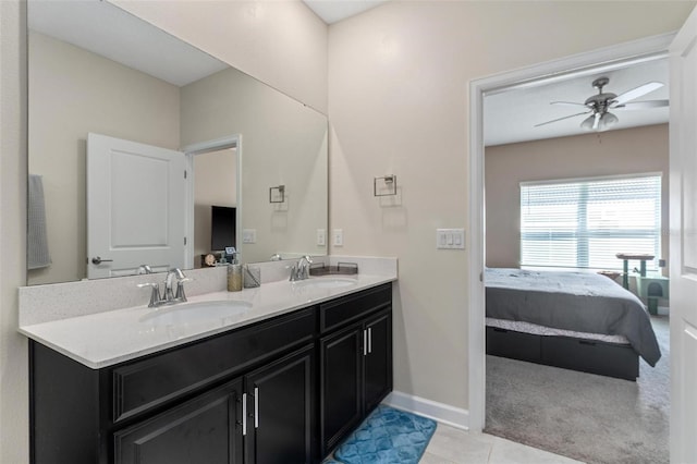 1079 Quaker Ridge Ln, Davenport, FL 33896 - bathroom featuring double vanity, ceiling fan, ensuite bathroom, and a sink