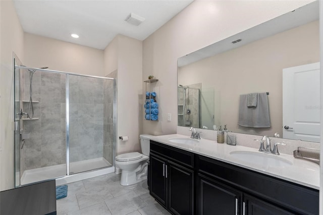 1079 Quaker Ridge Ln, Davenport, FL 33896 - bathroom featuring visible vents, a shower stall, toilet, and a sink