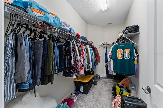 1079 Quaker Ridge Ln, Davenport, FL 33896 - spacious closet featuring visible vents and carpet