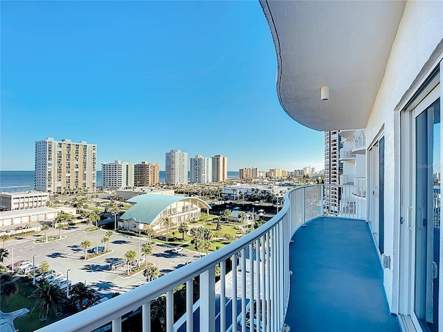 balcony with a view of city and a water view