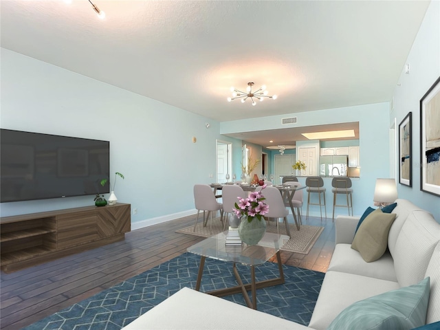 2 Oceans W Blvd Unit 1007, Daytona Beach, FL 32118 - living room featuring hardwood / wood-style flooring, a chandelier, and baseboards