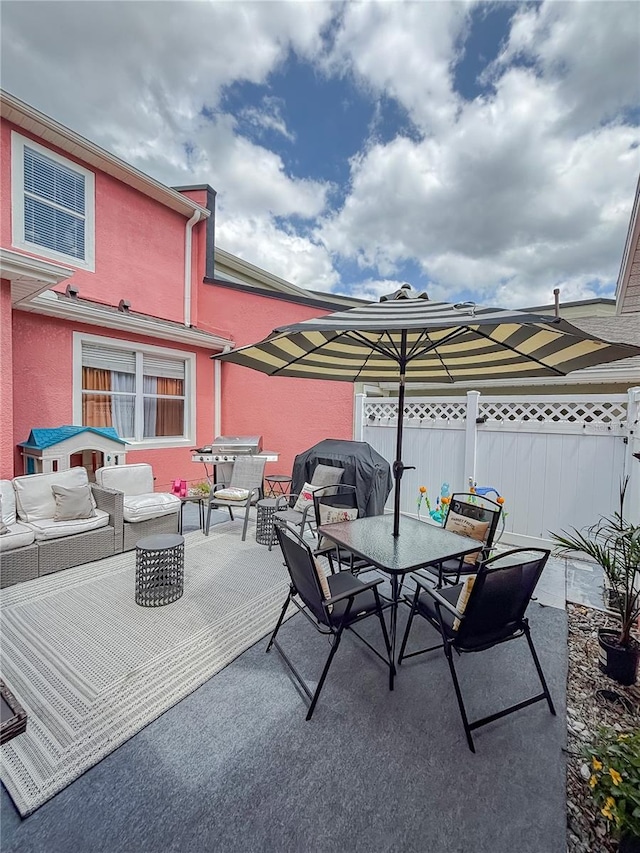 103 Manor View Ln, Deland, FL 32724 - view of patio featuring grilling area, fence, an outdoor living space, and outdoor dining space