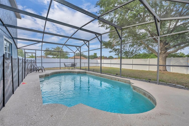 view of swimming pool with a lanai, a fenced backyard, a fenced in pool, and a patio area