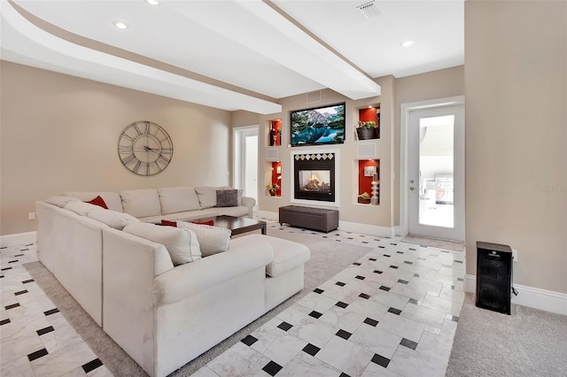 living area with a multi sided fireplace, recessed lighting, and baseboards