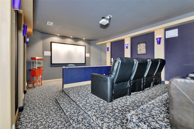 carpeted home theater with baseboards