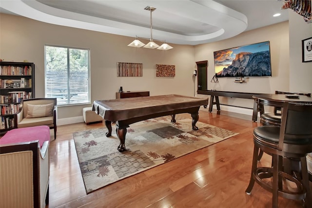 recreation room with a raised ceiling, baseboards, billiards, wood finished floors, and recessed lighting