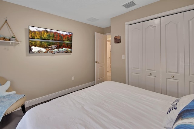 bedroom featuring a closet and baseboards