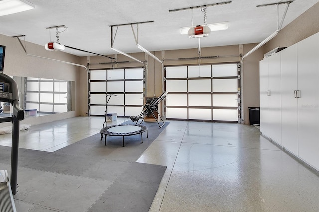 garage featuring a garage door opener